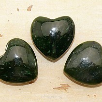 Canadian jade in the shape of a heart in the palm