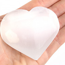 Selenite in the shape of a heart in the palm of 5 cm