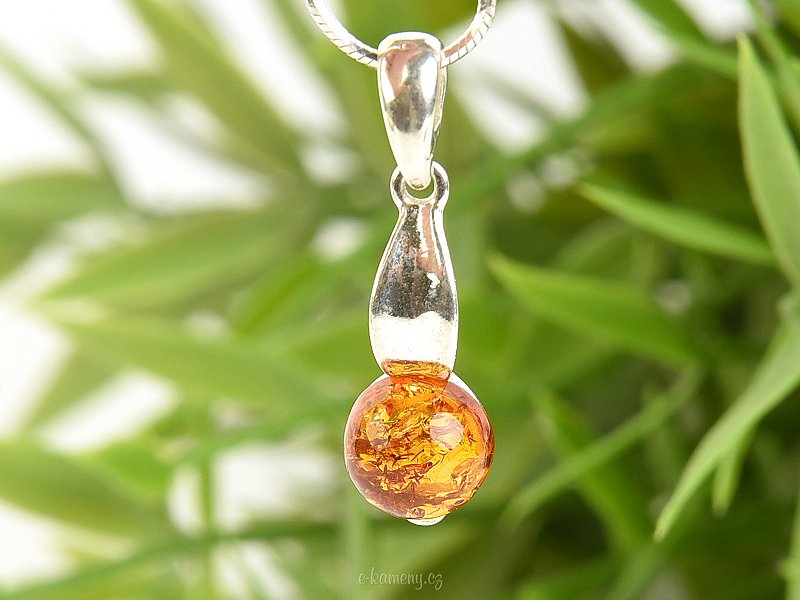 Amber in the shape of a ball in a pendant Ag 925/1000
