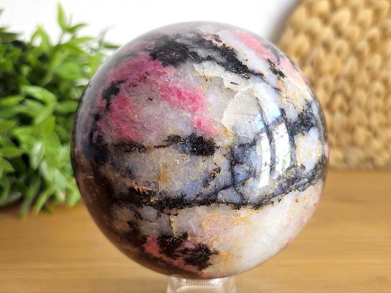 Stone in the shape of a ball of rhodonite with a diameter of 9.0 cm