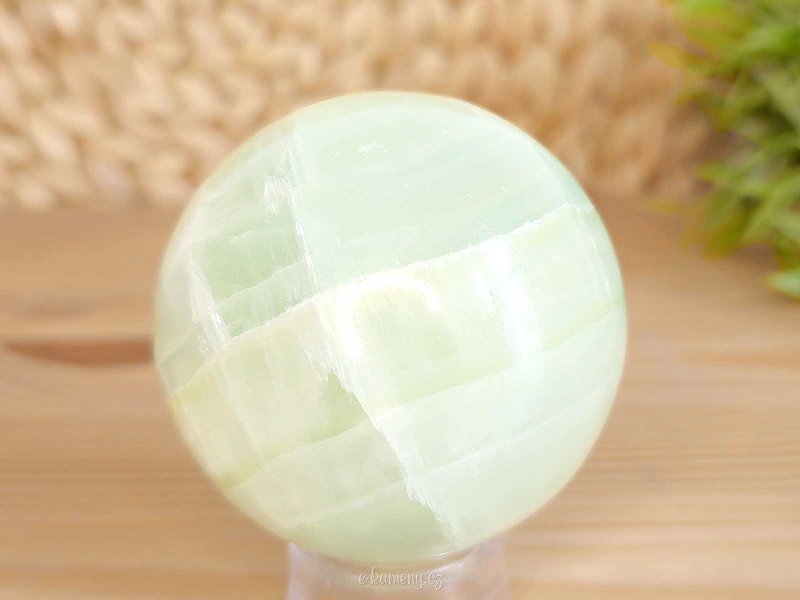 Pistachio calcite stone in the shape of a sphere 311 grams