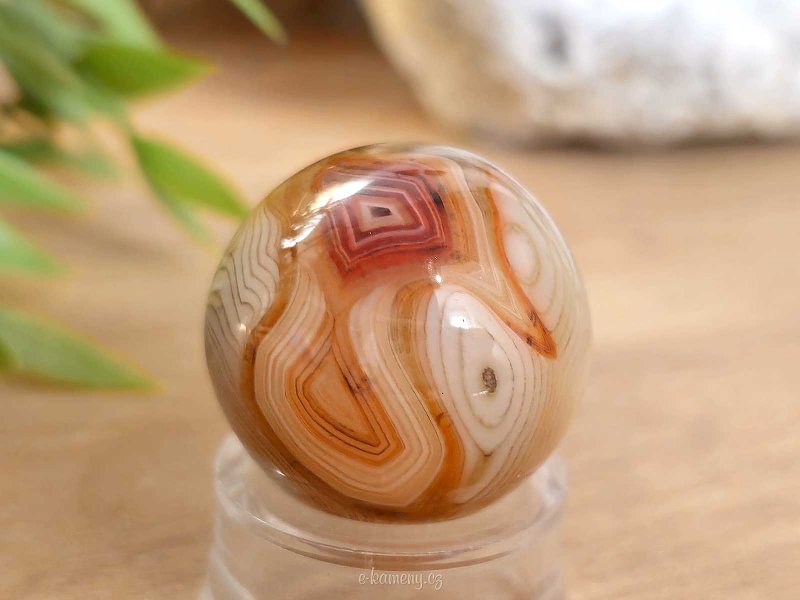 A sardonyx agate stone in the shape of a ball 38 grams