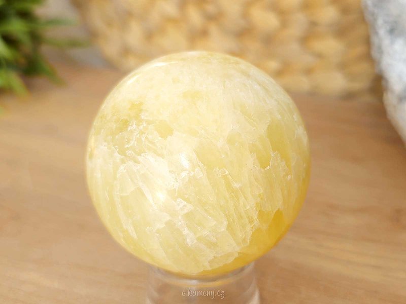 Lemon calcite stone in the shape of a ball 264 grams