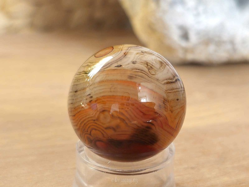 Stone sardonyx agate in the shape of a smooth ball 49 grams