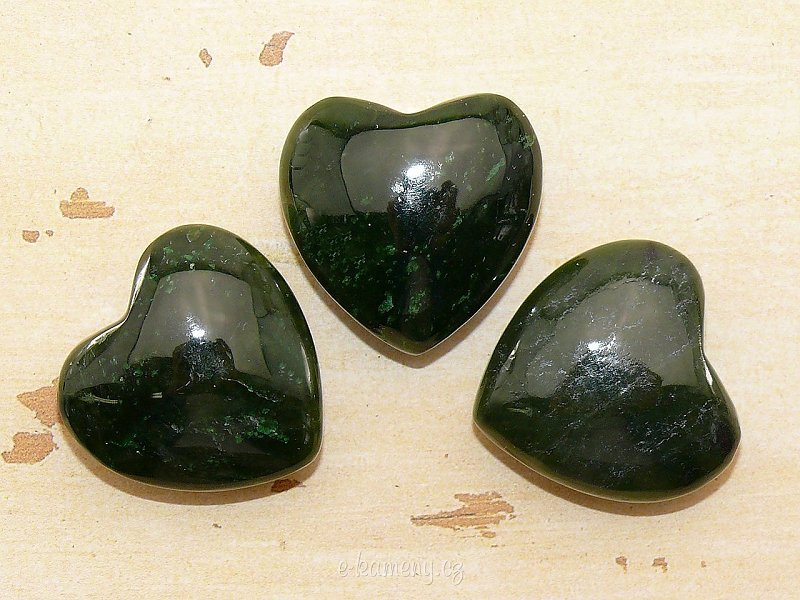 Canadian jade in the shape of a heart in the palm