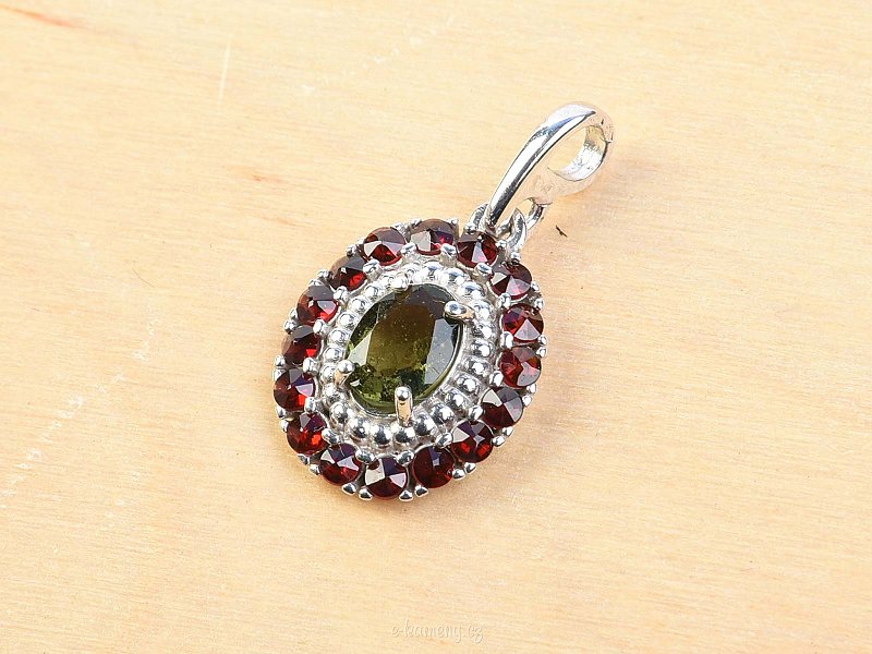 Oval pendant decorated with moldavite and garnets Ag 925/1000 Rh