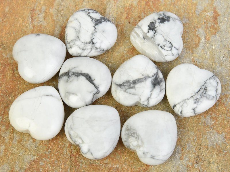 Heart made of stone magnesite in palm