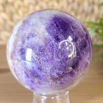 A chevron amethyst stone in the shape of a charm with a diameter of 6.6 cm