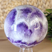 A chevron amethyst stone in the shape of a sphere with a diameter of 9.5 cm