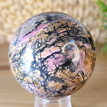 Rhodonite stone in the shape of a ball with a diameter of 6.9 cm