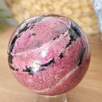 Rhodonite stone in the shape of a ball 668 grams