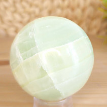 Pistachio calcite stone in the shape of a sphere 311 grams
