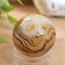 A sardonyx agate stone in the shape of a ball 43 grams