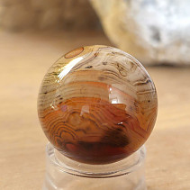 Stone sardonyx agate in the shape of a smooth ball 49 grams