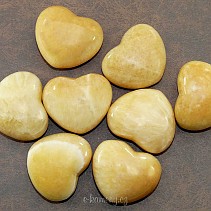 Heart of yellow calcite in hand