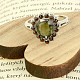 Ring with vltavine and drop-shaped garnets Ag 925/1000 + Rh