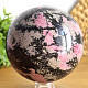 Rhodonite stone in the shape of a ball with a diameter of 10.5 cm