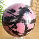 Smooth ball of rhodonite stone 1256g