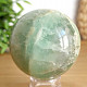 Fluorite stone in the shape of a ball with a diameter of 6.4 cm