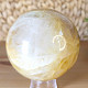 Crystal stone with limonite in the shape of a sphere with a diameter of 8.0 cm