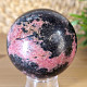 Rhodonite stone in the shape of a ball with a diameter of 6.2 cm