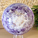 A chevron amethyst stone in the shape of a sphere with a diameter of 9.5 cm