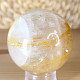 Crystal stone with limonite in the shape of a ball with a diameter of 5.8 cm