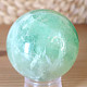 Green fluorite stone in the shape of a ball with a diameter of 5.3 cm