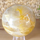 Crystal stone with limonite in the shape of a sphere with a diameter of 8.0 cm