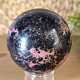 Rhodonite stone in the shape of a ball with a diameter of 6.2 cm