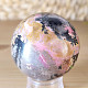 Rhodonite stone in the shape of a ball with a diameter of 5.3 cm