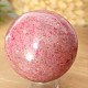 Rhodonite stone in the shape of a ball 528 grams