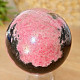 Rhodonite stone in the shape of a ball 528 grams