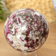 Tourmaline rubellite stone in quartz in the shape of a sphere 408 grams