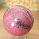 Rhodonite stone in the shape of a ball 441 grams