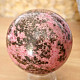 Rhodonite stone in the shape of a ball 443 grams