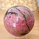 Rhodonite stone in the shape of a ball 390 grams