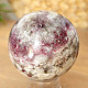 Tourmaline rubellite stone in quartz in the shape of a ball 269 grams