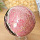 Rhodonite stone in the shape of a ball 668 grams