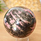 Rhodonite stone in the shape of a ball 570 grams