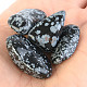 Stone obsidian flake of about 2.5 cm - 3cm
